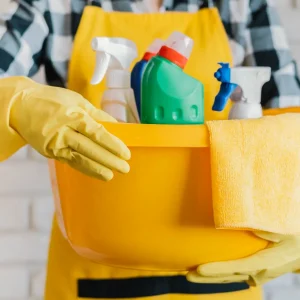 adult-holding-basket-with-cleaning-products